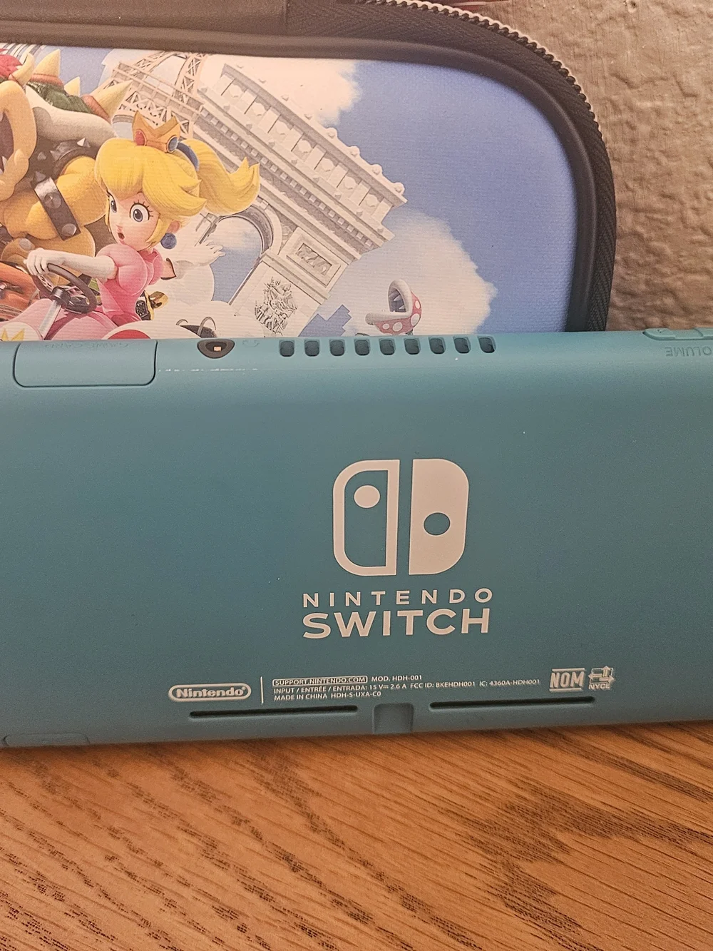Nintendo Switch Lite (Blue) + Mario Kart Carrying Case